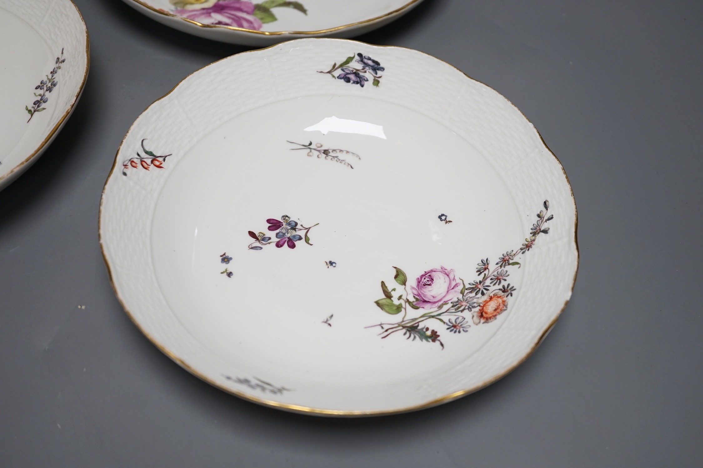 A group of three 18th century Meissen flower painted dishes and a similar late 18th century Vienna ewer, 20cm tall